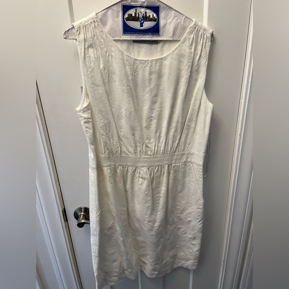 White dress with texture and side zip. Great condition.